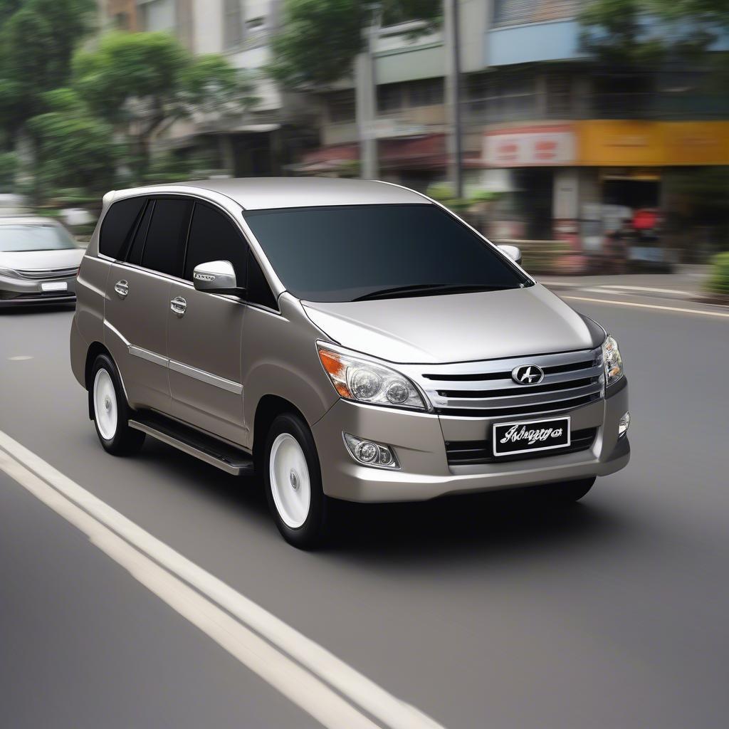 Kijang Innova Độ Gầm Ceper: Hình ảnh một chiếc Kijang Innova độ gầm thấp, với bộ mâm thể thao, lướt trên đường phố.