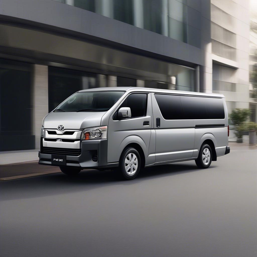 Hình ảnh ngoại thất Toyota Hiace Commuter 2019, màu bạc, nhìn từ góc nghiêng phía trước.